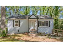 Charming, renovated one story home with painted brick and a welcoming front porch at 2162 Doris Dr, Decatur, GA 30034