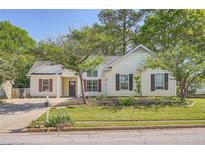 Charming one story home with manicured lawn and a combination of windows and shutters at 772 Bostonian Way, Lawrenceville, GA 30046