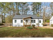 Charming renovated bungalow with board and batten siding, new roof, and manicured front lawn at 1111 Edgefield Sw Dr, Atlanta, GA 30310