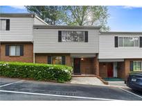 Charming townhome featuring brick accents, neutral siding, and mature landscaping at 3326 Northcrest Rd # C, Atlanta, GA 30340