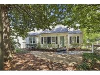 Charming home with mature trees and tidy landscaping creating an inviting curb appeal at 391 Collier Nw Rd, Atlanta, GA 30309