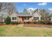 Charming single-story home with a cozy front porch and manicured landscaping, creating an inviting curb appeal at 162 Brookhaven Way, Rockmart, GA 30153