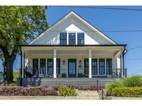 Charming two-story home with a welcoming front porch and manicured landscaping, perfect for curb appeal at 1076 Manigault Se St, Atlanta, GA 30316