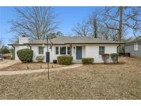 Charming home featuring well-maintained landscaping, a brick facade, and a cozy entryway, creating inviting curb appeal at 2265 Starline Dr, Decatur, GA 30032