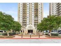 Stunning high-rise building featuring private balconies and a beautifully landscaped entrance with a fountain at 795 Hammond Dr # 806, Sandy Springs, GA 30328