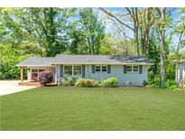 Charming single-story home with a well-manicured lawn and inviting front porch at 2793 Horse Shoe Dr, Atlanta, GA 30316
