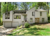 Bright two-story home featuring a two-car garage, stone accents and a inviting front entrance at 3923 Lookout Point Dr, Marietta, GA 30066