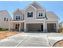 Beautiful two-story home with a three-car garage and craftsman-style details, offering ample parking at 3375 Hillshire Dr, Cumming, GA 30028