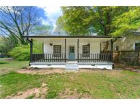 Charming single-story home featuring a quaint front porch and freshly painted exterior at 1917 Connally Dr, Atlanta, GA 30344