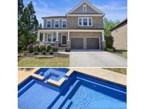 Charming two-story home with stone accents, covered porch, manicured landscaping, and a two-car garage at 526 Lost Creek Dr, Woodstock, GA 30188