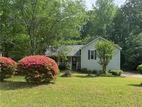 Charming single-Gathering home with well-maintained lawn and beautiful flowering shrubbery at 861 Creek Nw Trl, Kennesaw, GA 30144