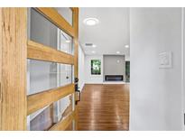 Inviting entryway featuring a modern wood door with glass panes and hardwood floors at 800 Kiowa Ne Dr, Marietta, GA 30060