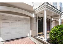 Charming townhome featuring a convenient attached garage and welcoming covered entryway at 375 Highland Ne Ave # 1011, Atlanta, GA 30312