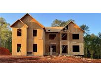 Two-story new construction home featuring a classic architectural design with wood frames and unfinished exterior, set on a spacious lot at 237 Lotus Ln, Covington, GA 30016