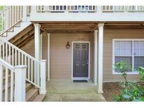 Inviting front entry featuring covered porch, neutral siding, and well-maintained stairs at 2120 River Heights Se Walk, Marietta, GA 30067