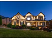 Inviting two-story home featuring manicured landscaping and subtle exterior lighting at 2270 Abbey Cove Ct, Marietta, GA 30062