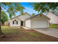 Charming single-story home with a well-manicured front yard and a two-car garage, perfect for a small Gathering at 175 Regency Park Dr, Mcdonough, GA 30253