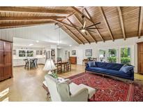 Spacious living room with hardwood floors, vaulted wood ceilings, and open floor plan at 3311 Stillhouse Se Rd, Atlanta, GA 30339