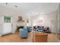 Inviting living room with fireplace, tile floors, and bright, neutral decor at 5180 Chemin De Vie, Atlanta, GA 30342