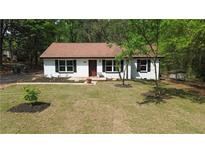 Charming, freshly renovated one-story home with a well-manicured lawn and lovely curb appeal at 6881 Homestead Rd, Rex, GA 30273