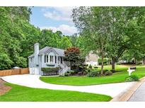 Charming home featuring beautiful landscaping, bay window, and a well-manicured lawn at 489 Warrenton Dr, Douglasville, GA 30134