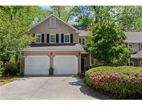 Charming two-story home featuring a two-car garage, well-maintained landscaping, and inviting curb appeal at 403 S River Farm Dr, Alpharetta, GA 30022
