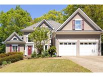 Charming two-story home with a well-manicured lawn and attached two-car garage at 4016 Upland Trce, Marietta, GA 30066
