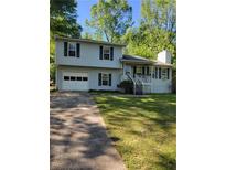 Charming two-story home with a one-car garage and well-maintained front yard at 4775 Ben Hill Rd, Douglasville, GA 30134