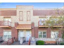 Charming brick townhome with cozy balcony and well-maintained landscaping, offering an inviting curb appeal at 432 Ira Sw St # 201, Atlanta, GA 30312