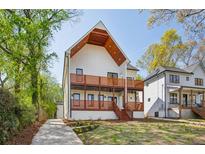 Stunning two-story modern farmhouse with wood balconies and beautiful curb appeal at 1882 Francis Nw Ave, Atlanta, GA 30318