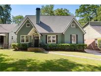 Charming green bungalow with a symmetrical design and well-manicured lawn at 2759 Arbor Se Ave, Atlanta, GA 30317