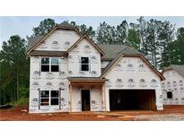 New construction two-story home featuring an attached two-car garage and covered entry, ready for finishing touches at 484 Charleston Pl, Villa Rica, GA 30180