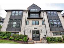 Elegant building featuring a white brick facade and black window trim at 6603 Sterling Dr, Atlanta, GA 30328