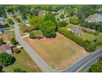 A nice aerial view of a vacant lot in a wooded residential neighborhood, perfect for building a dream home at 1312 Harbins Rd, Dacula, GA 30019