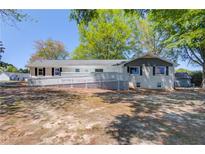 Charming single-story home with accessible ramp and spacious backyard, perfect for outdoor living at 1312 Harbins Rd, Dacula, GA 30019