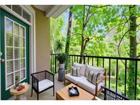Inviting balcony with comfortable seating and lush green views at 4201 Stratford Commons, Decatur, GA 30033