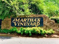 Stone sign for Martha's Vineyard community with lush greenery around it at 2605 Vineyard Se Way, Smyrna, GA 30082