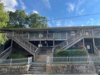 Attractive apartment complex with wooden stairs and white picket fence around a stone base at 562 Formwalt Sw St # 4, Atlanta, GA 30312