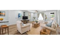 Bright living room with a ceiling fan, modern furnishings, and stylish decor accents at 3917 Dallas Acworth Nw Hwy, Acworth, GA 30101