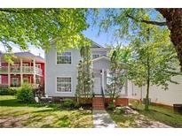 Charming two-story home with a manicured lawn and inviting front porch at 1008 Lena Nw St, Atlanta, GA 30314