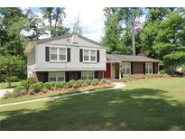 Charming two-story home with black shutters and a landscaped yard at 2977 Karen Ln, Marietta, GA 30062