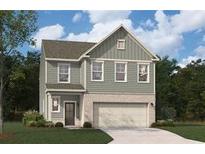 Charming two-story home featuring a neutral color scheme, attached garage, and well-manicured lawn at 407 Newland Way, Acworth, GA 30102