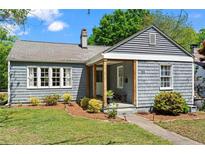 Charming home featuring classic architecture, a cozy porch, and a well-maintained front yard at 756 Ormewood Se Ave, Atlanta, GA 30312