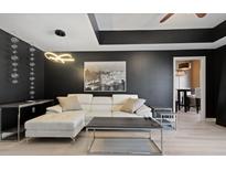 Modern living room features stylish furniture, unique light fixture, and elegant decor at 195 14Th St # 1403, Atlanta, GA 30309