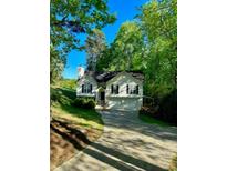 Two-story home featuring mature trees and a well-maintained yard at 2180 Ridge Rd, Canton, GA 30114