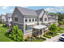Beautiful exterior elevation of townhomes with charming landscaping and meticulous architectural details at 2004 Cortland Rd, Milton, GA 30009