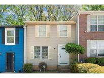 Charming townhouse featuring a well-maintained front yard and classic architecture at 1784 Timber Valley Se Way, Smyrna, GA 30080