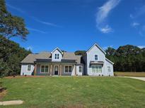 Charming home featuring a well manicured lawn, inviting entrance, and a classic design at 1715 Crumbley Rd, Mcdonough, GA 30252
