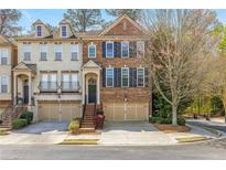 Charming brick townhome with attached garage and manicured landscaping in a desirable neighborhood at 2827 Overlook Ne Trce, Atlanta, GA 30324