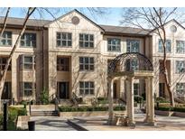 Beautiful townhome featuring meticulously maintained landscaping and a charming outdoor gazebo at 3475 Oak Valley Rd # 130, Atlanta, GA 30326
